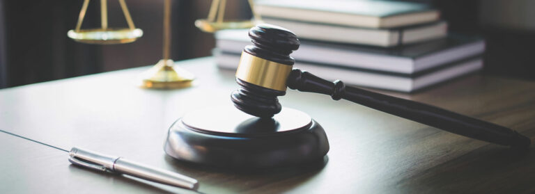 gavel on desk with justice scales