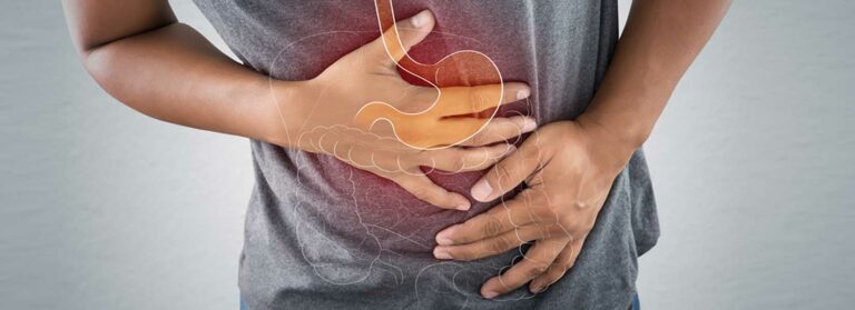 man holding stomach in pain