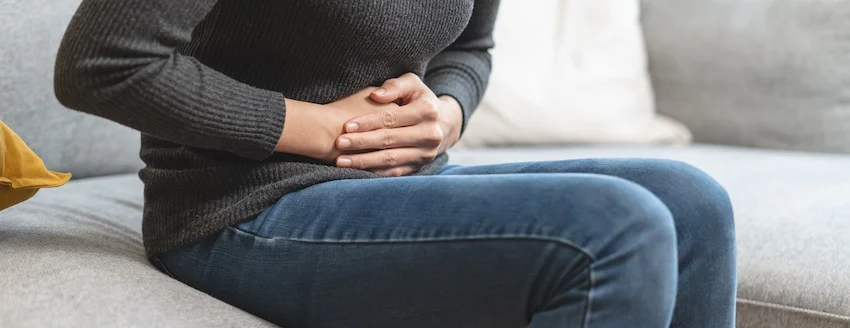 This woman needs to file an Oxbryta lawsuit after the medication caused her abdominal pain.