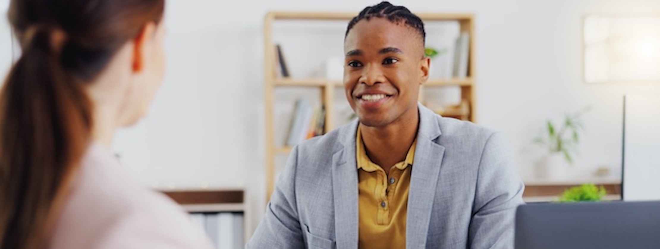 Choosing the Right Mass Tort Lawyer for Your Case African American male lawyer in consultation, planning, and discussion with a Caucasian female in an office setting.