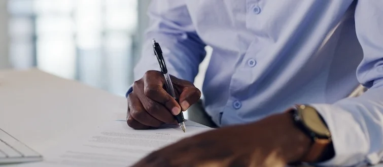 A professional is signing legal documents for corporate negligence lawsuits against companies responsible for consumer injuries and damages.