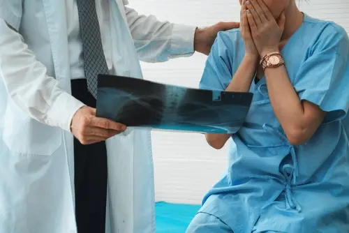 San Diego Medical Malpractice Lawyer Doctor with worried patient who needs a San Diego medical malpractice lawyer