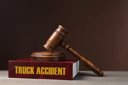 San Diego Truck Accident Lawyer Truck accident law book on desk of San Diego truck accident lawyer